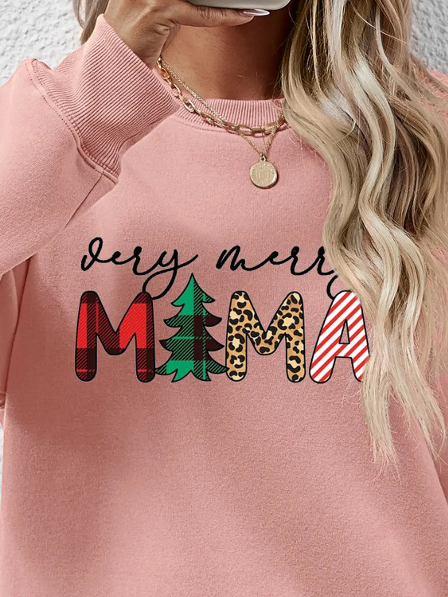 Blush pink long sleeve sweater with "very merry MAMA" graphic in plaid, tree, leopard, and stripe patterns.
