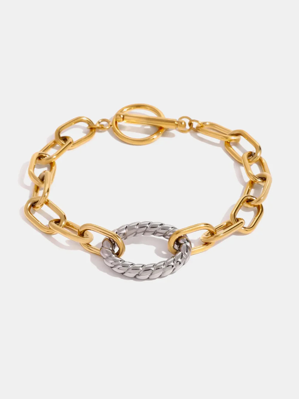 Two-tone chain link toggle bracelet with a textured oval center in gold and chrome.