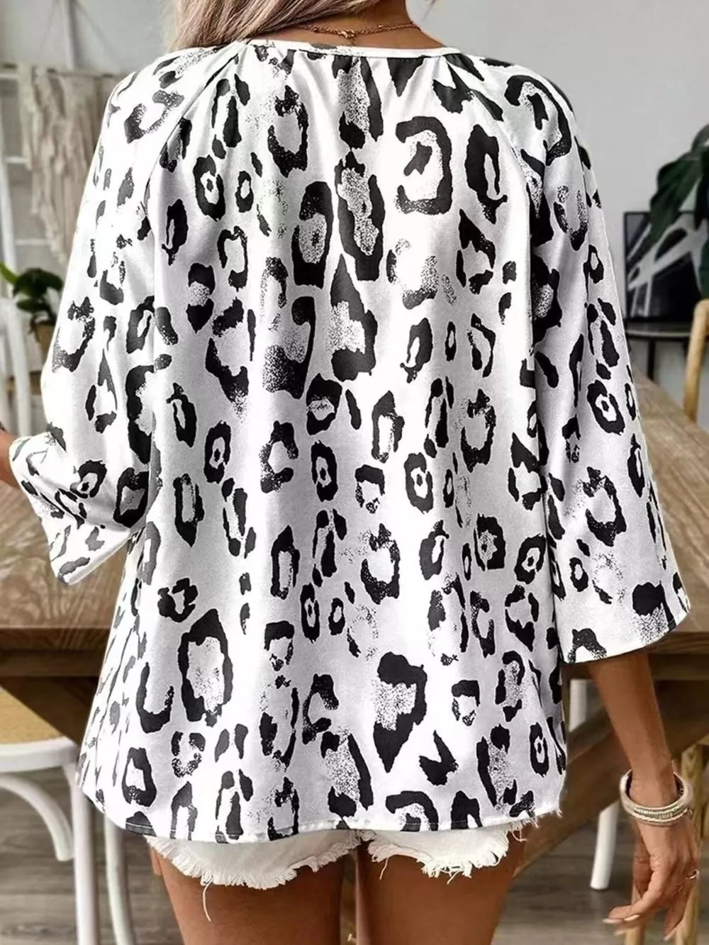 black blouse featuring tied and leopard-print