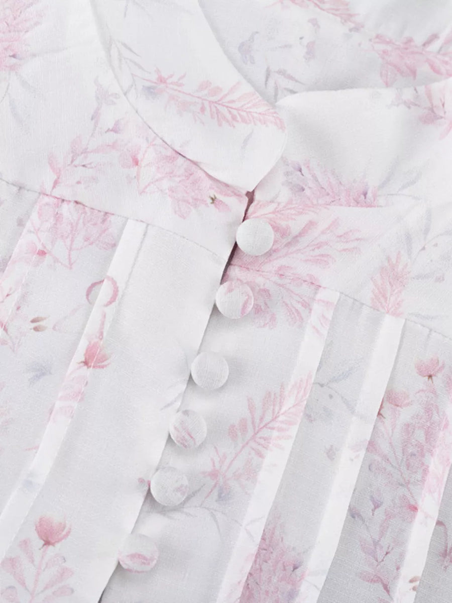 White floral print blouse with button front and pintuck details