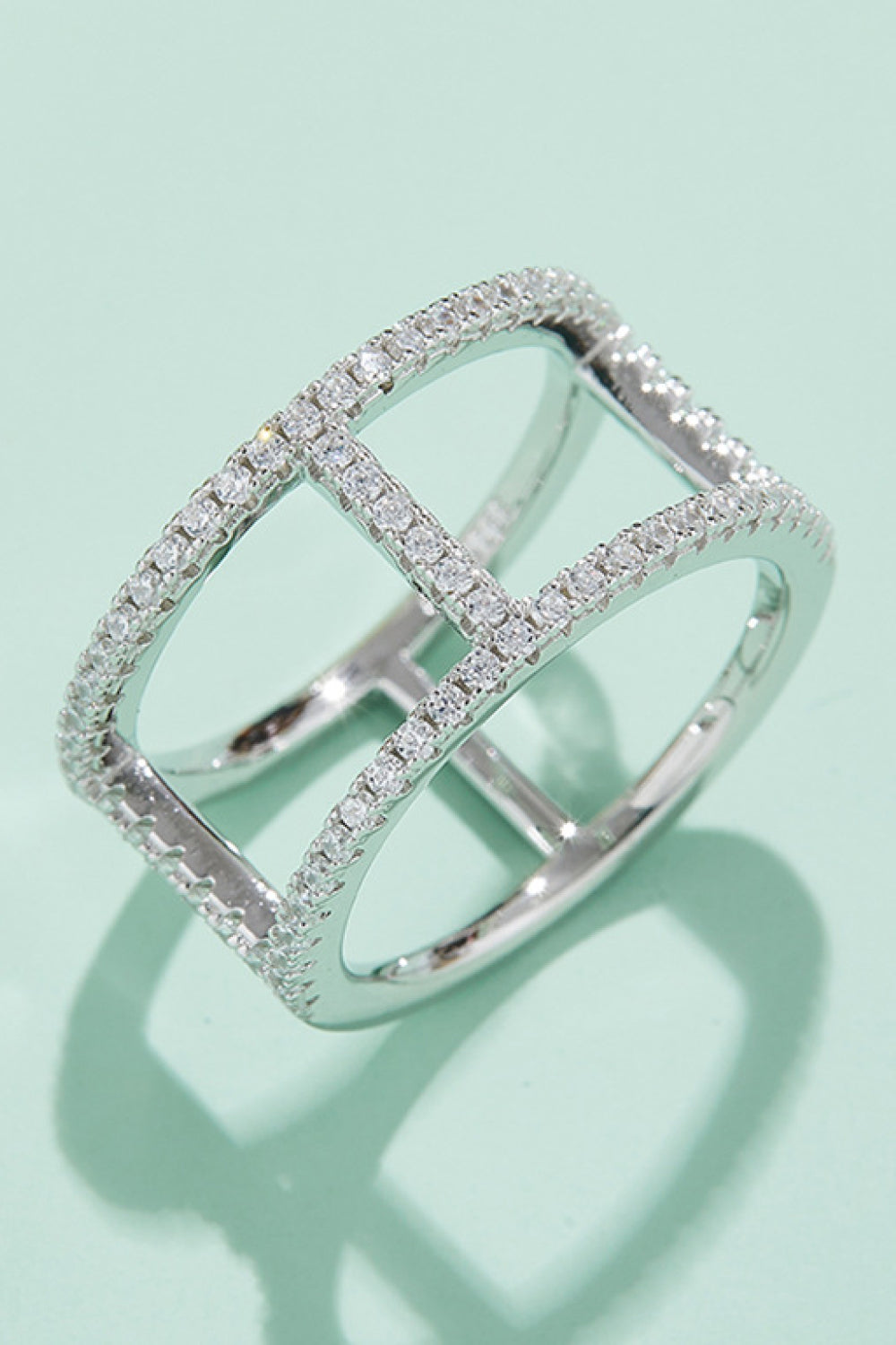 Silver geometric pave moissanite statement ring with open cage design
