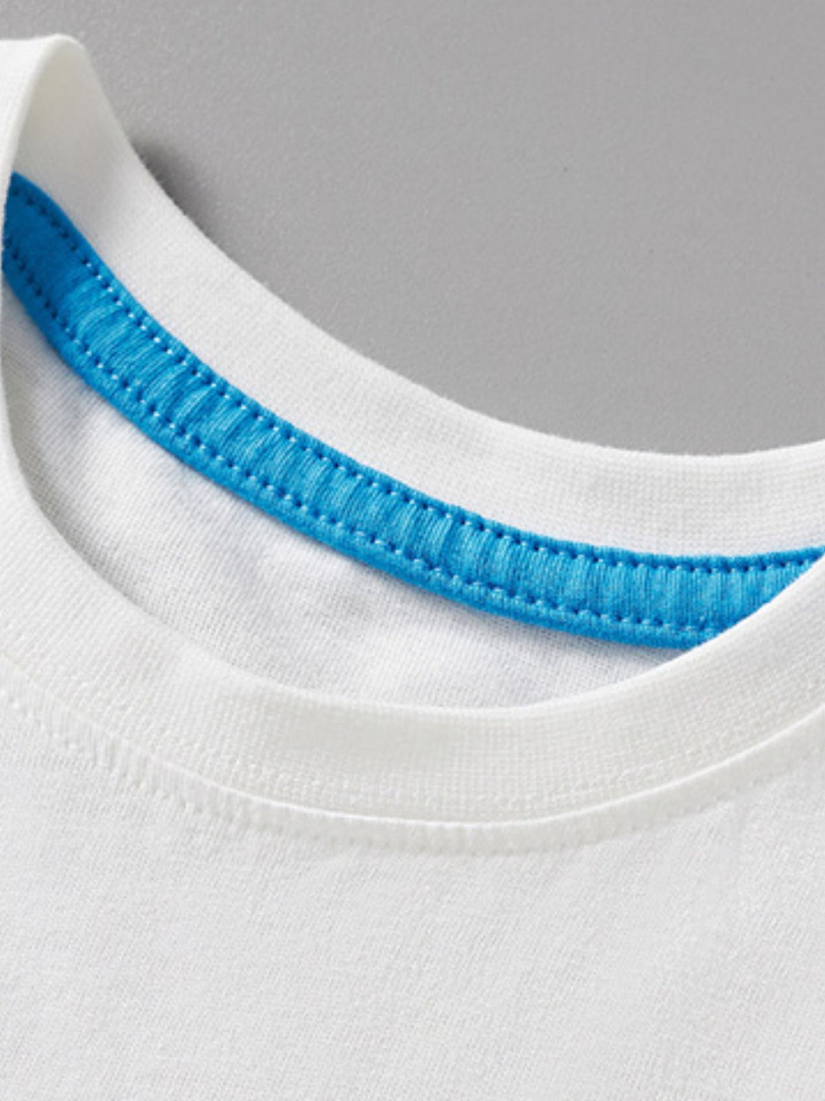 White cotton toddler t-shirt with blue stitched neckline detail