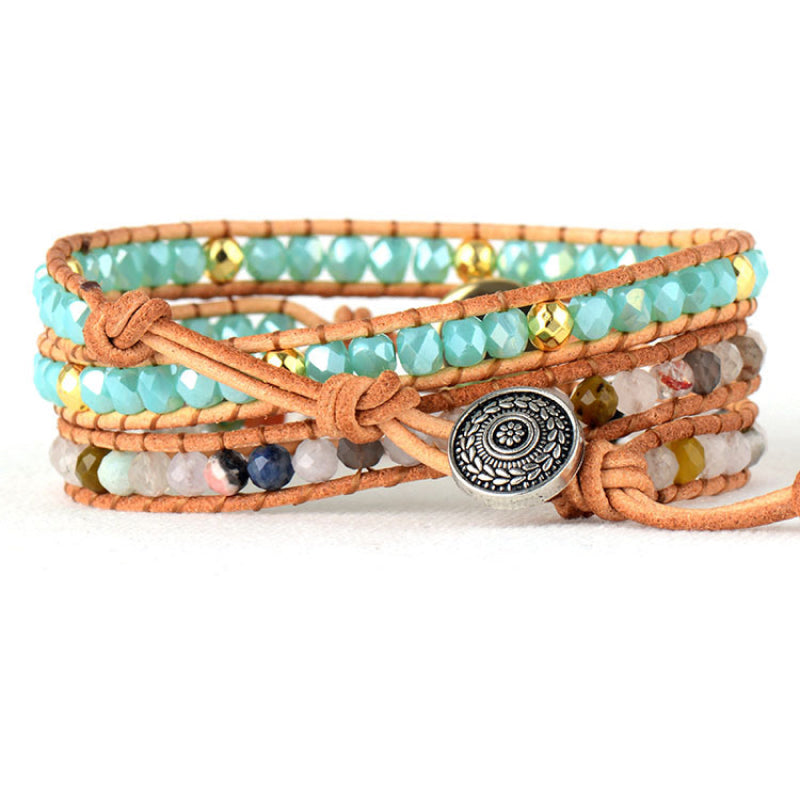 Bohemian wrap bracelet with multicolor beads, leather cords, and silver button closure.
