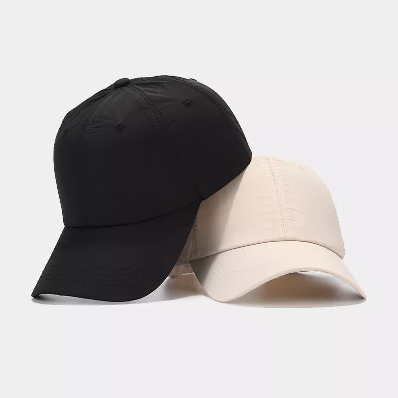 cap in black featuring adjustable strap and fitted fit