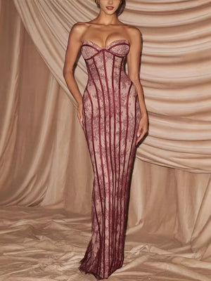 Burgundy lace sweetheart neckline maxi dress with corset detail and sheer skirt.
