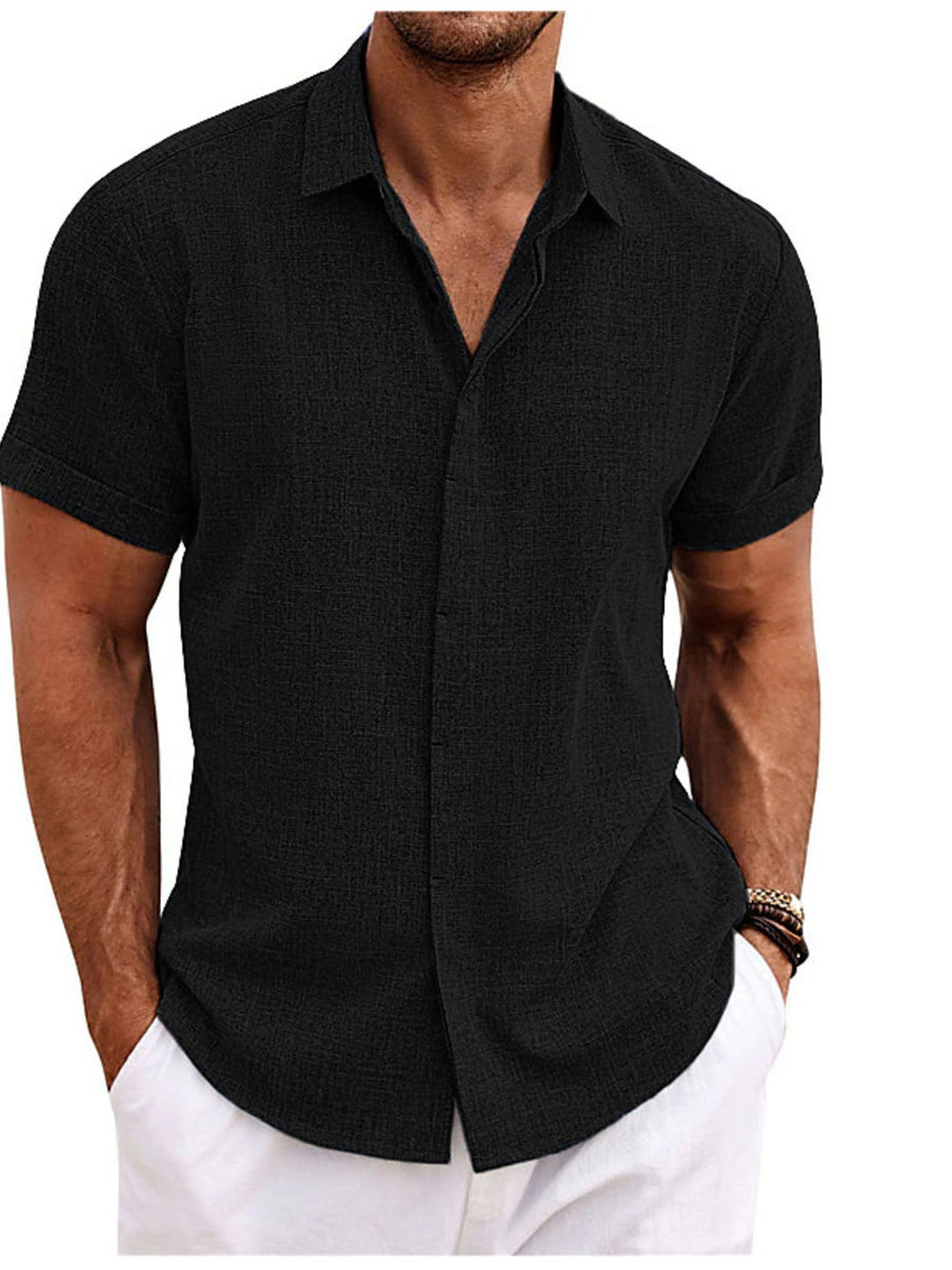 Men's black short sleeve button-down shirt with textured fabric.