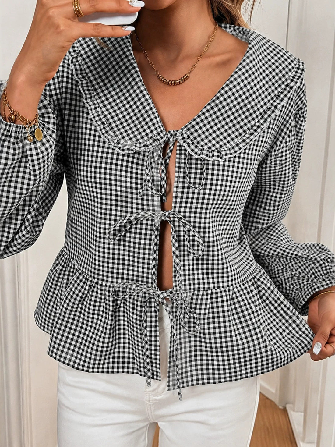 black peplum top with gingham and v-neck