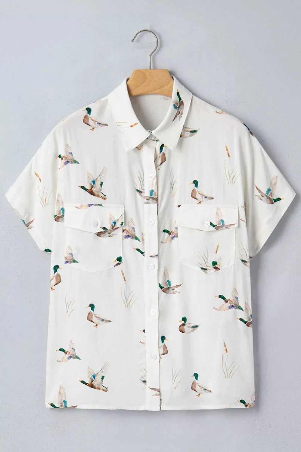 brown button-up shirt with flap pockets and short sleeve