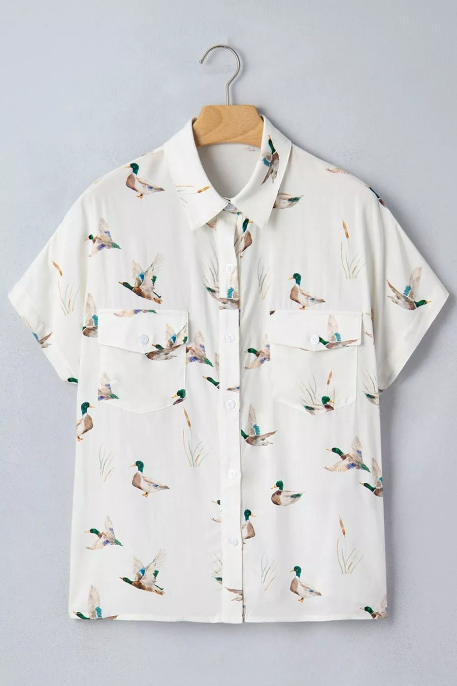 brown button-up shirt with flap pockets and short sleeve