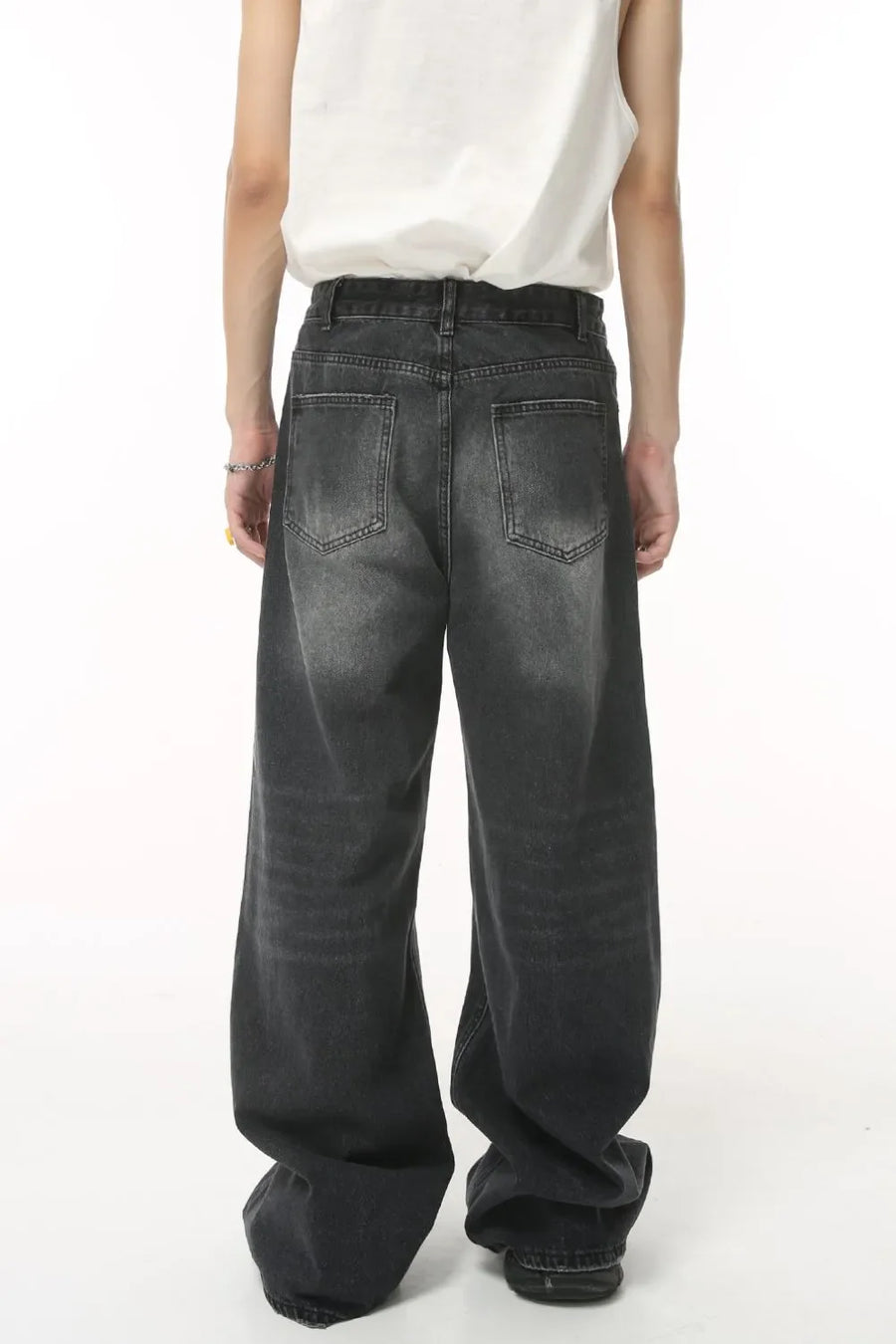 Oversized wash denim trousers in charcoal grey with a baggy fit and classic five-pocket styling.