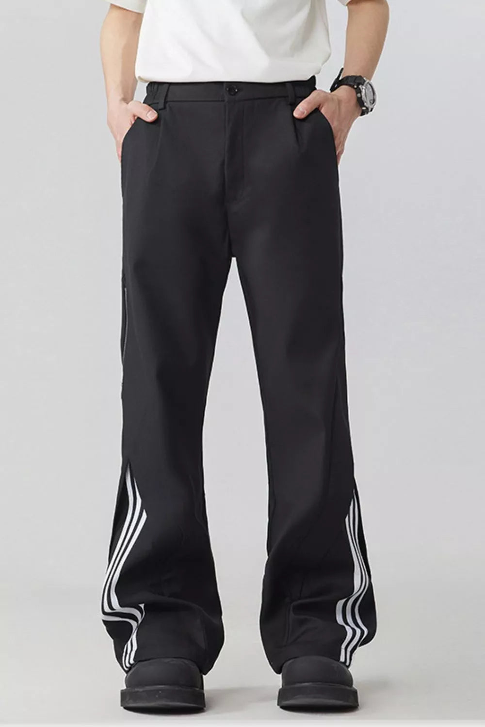 Men's black wide-leg sweatpants with white side stripes and drawstring waist.