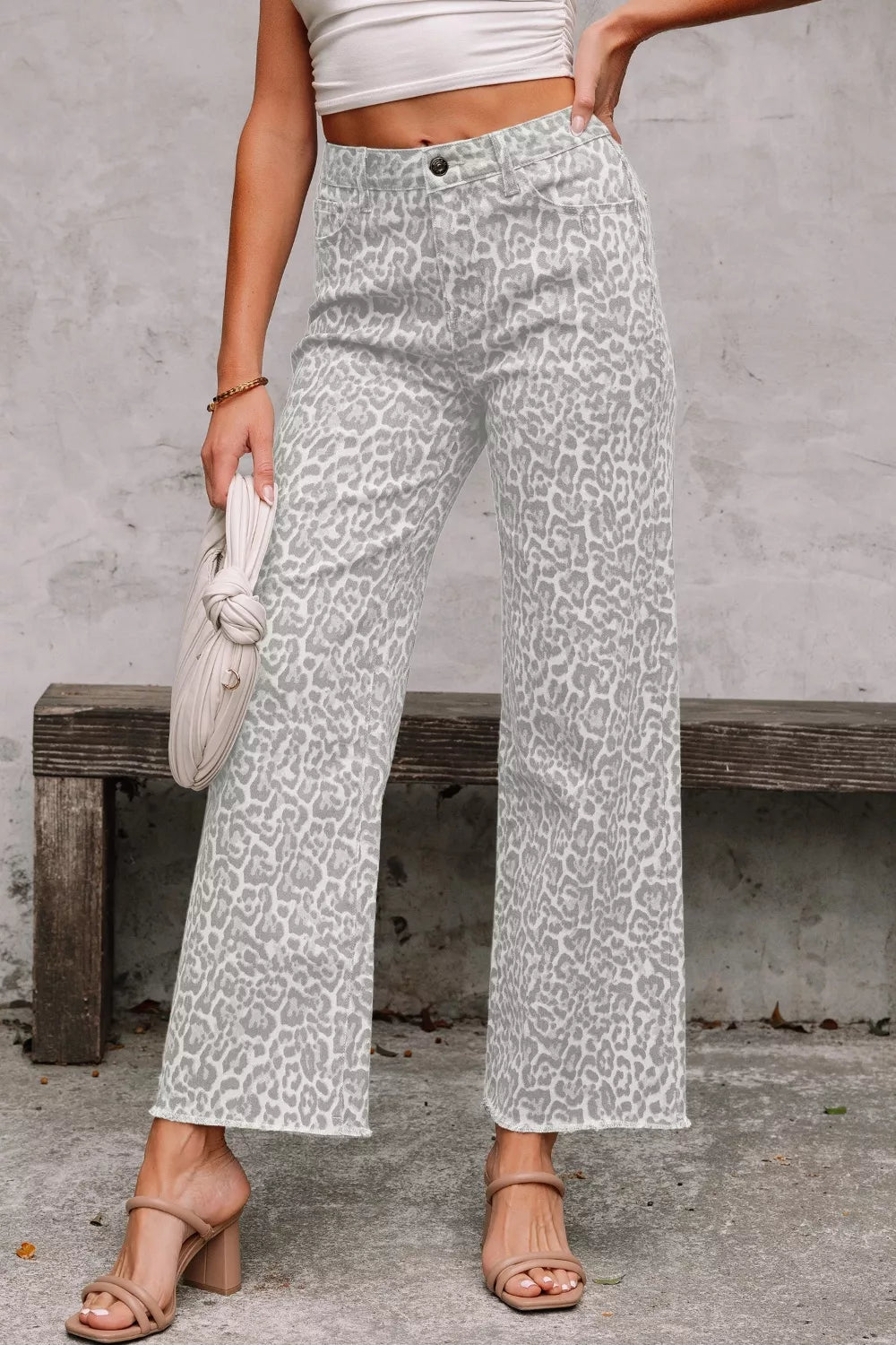 Chic grey leopard print high-waisted wide-leg jeans with frayed hem