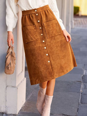 95% polyester, 5% spandex Care instructions: Machine wash cold midi skirt in Caramel with A-line silhouette