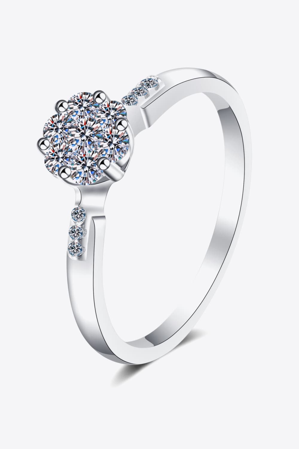 Silver floral cluster moissanite engagement ring with small accent stones on the band.