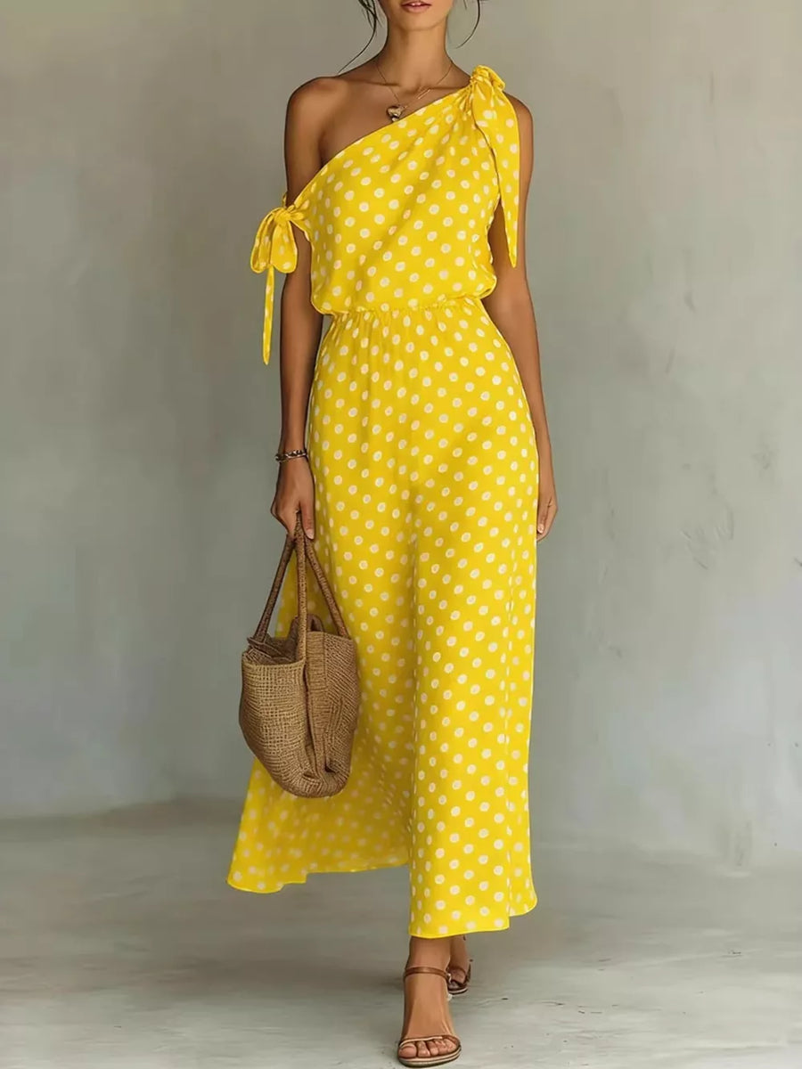 Yellow polka dot one-shoulder maxi dress with tie details and elastic waist
