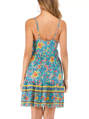Vibrant floral mini dress with spaghetti straps and tiered hem.