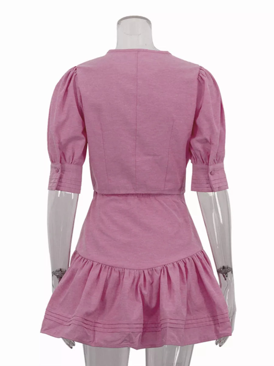 Pink puff sleeve crop top and ruffled mini skirt set with button cuffs