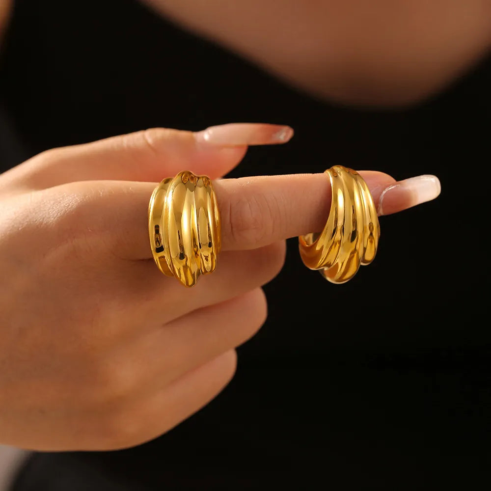 Sculpted gold ridge ring with vertical ribbed texture, 18K gold-plated.