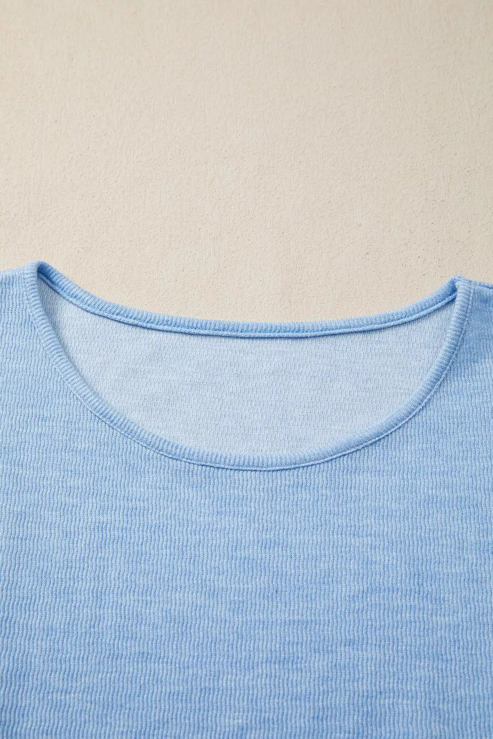 Light blue ribbed knit cap sleeve top with crew neck