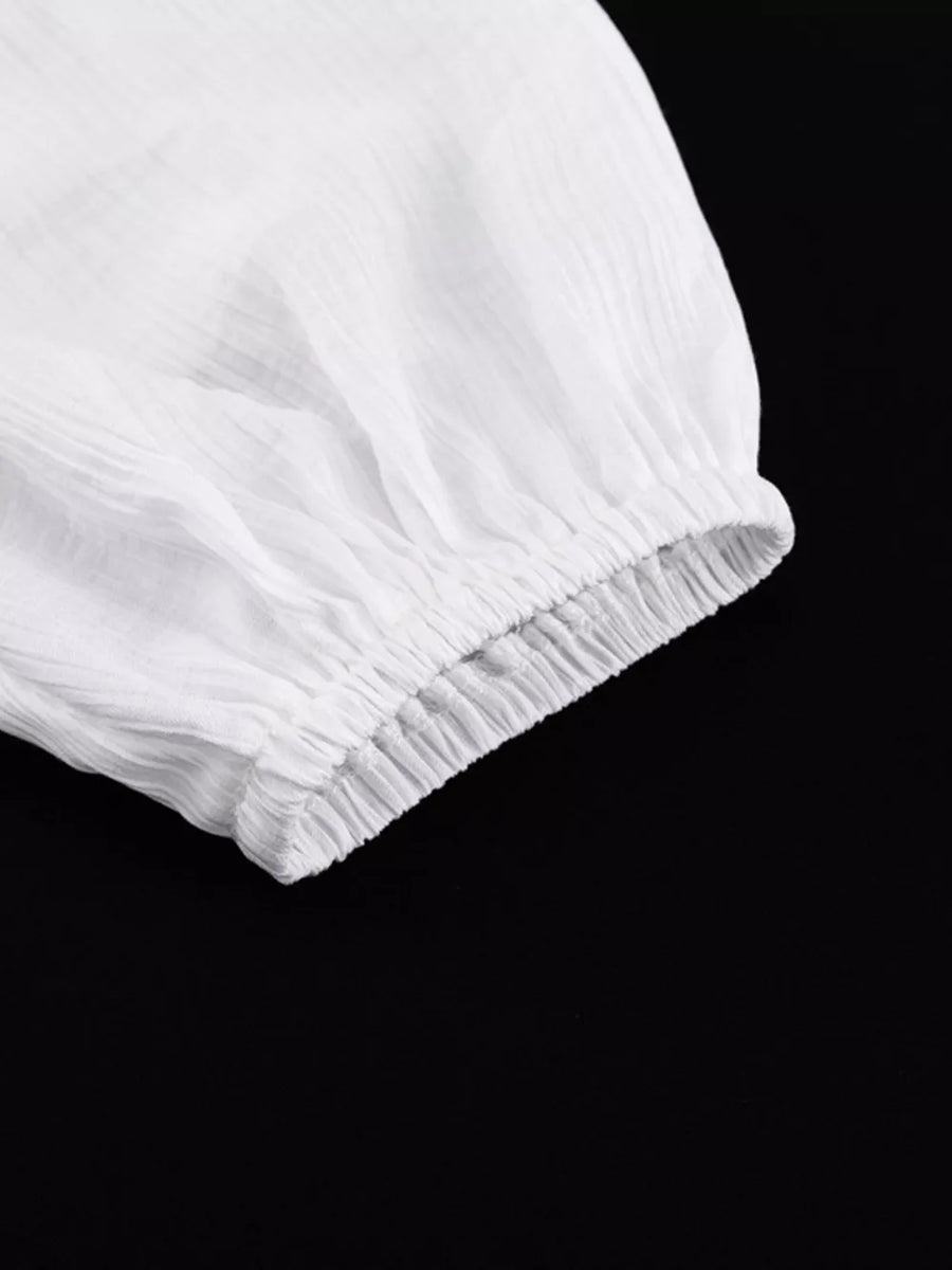 White crinkled fabric sleeve with elastic cuff