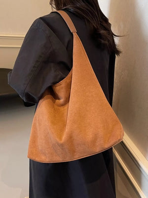 Elegant suede hobo tote mini in light brown with a single strap.