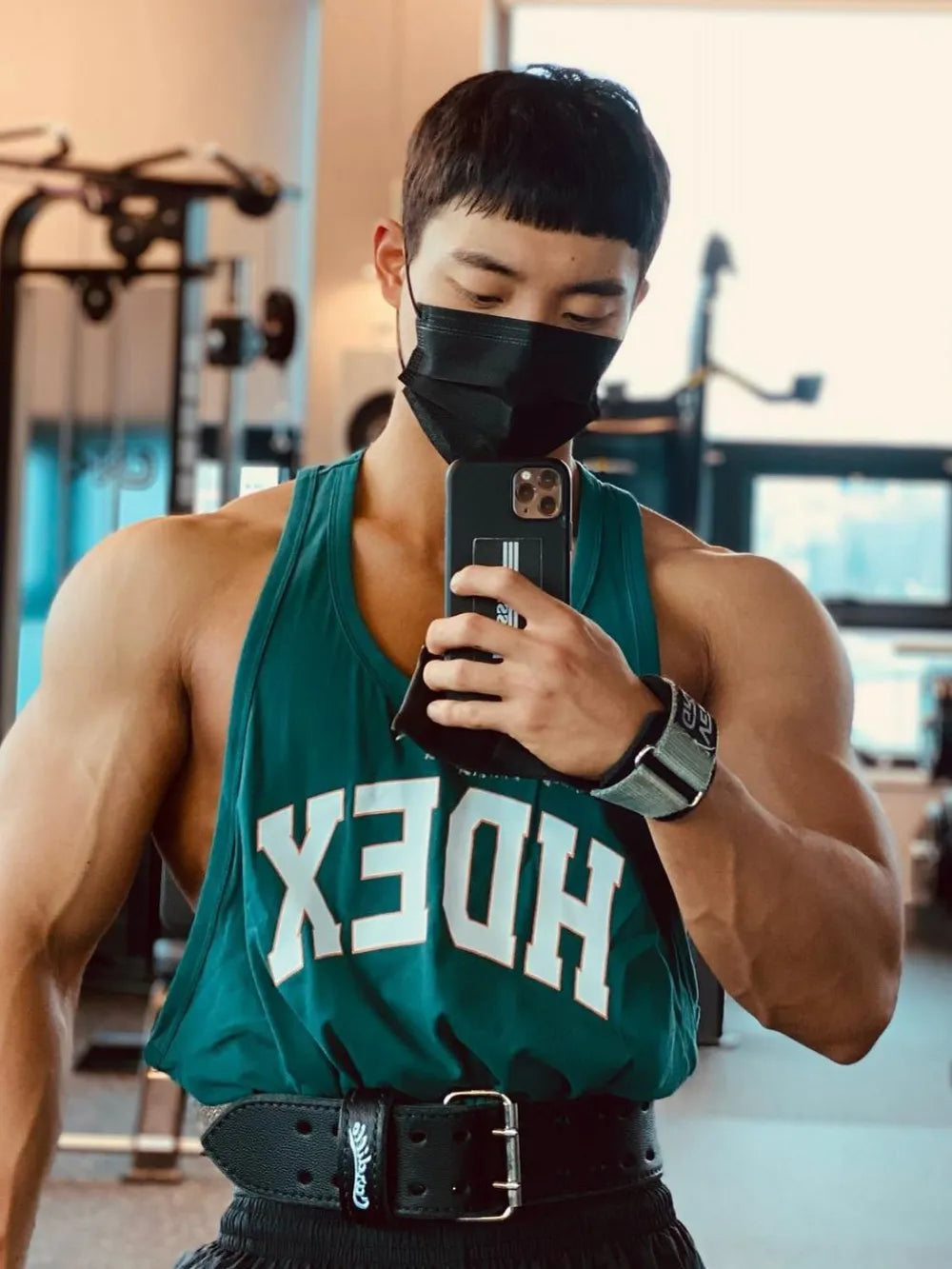 Deep Teal athletic tank top with white letter graphic and racerback.