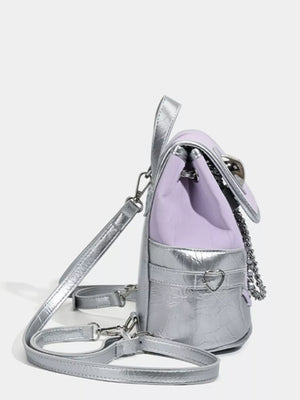 Charming mini heart flap backpack in purple and silver with chain detail.