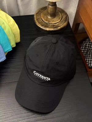 Black cotton baseball cap with embroidered logo detail