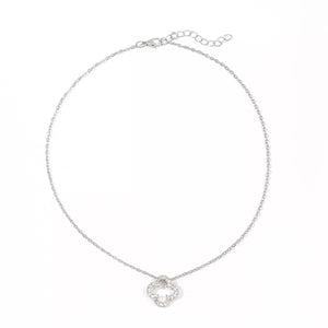 Silver clover pendant necklace with clear stones on a delicate chain.