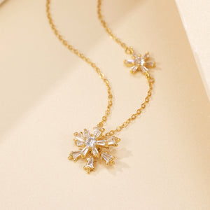 silver necklace featuring snowflake pendant and snowflake