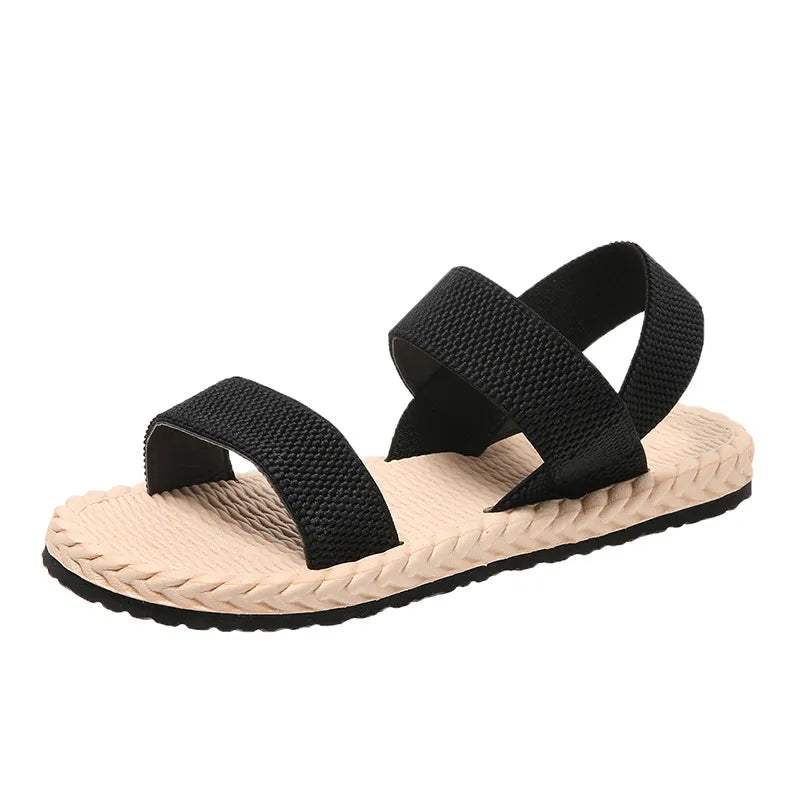 Black rope-sole cross-strap sandals with adjustable straps.