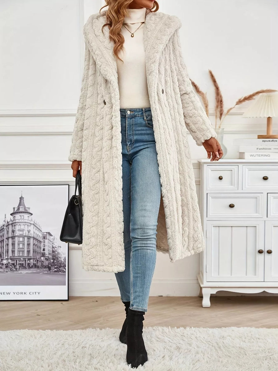Off-white hooded longline button up outerwear with cable knit texture and side slits.