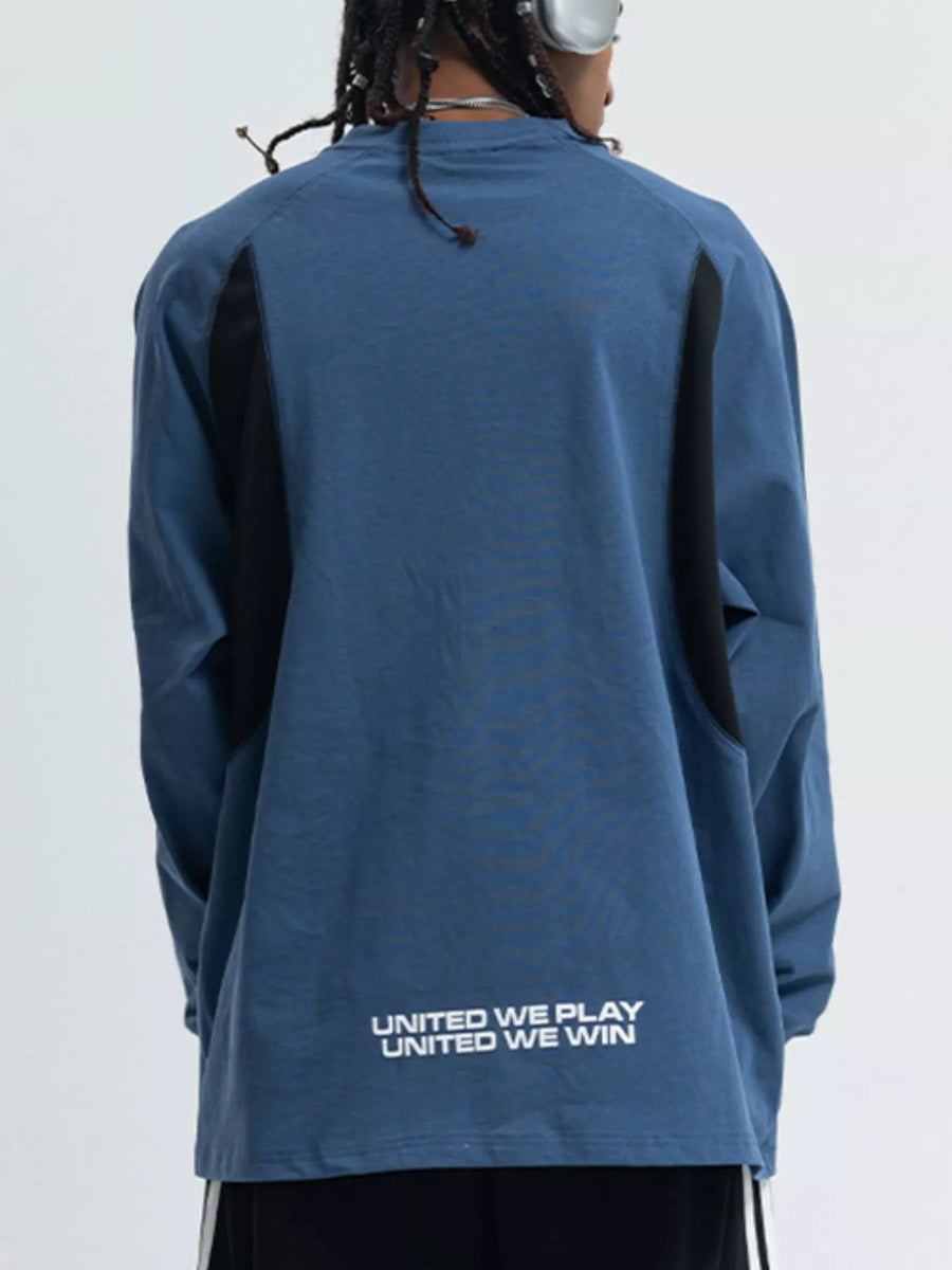 Relaxed fit long-sleeve tee in royal blue with black contrast panels and text graphic on back.