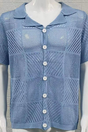 Light blue geometric knit polo shirt with button front and short sleeves