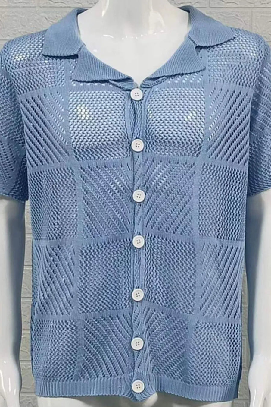 Light blue geometric knit polo shirt with button front and short sleeves