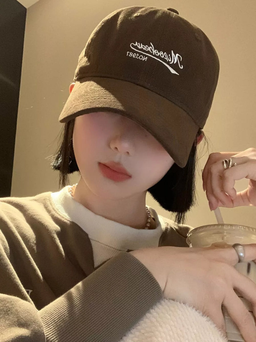 Deep Coffee embroidered letter baseball cap with curved brim.