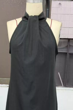 Black maxi dress with twisted halter neckline and a-line cut.