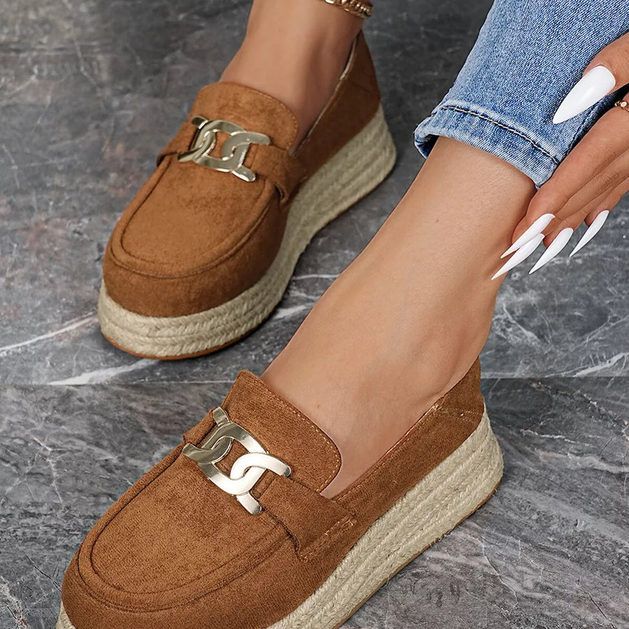 Brown round toe platform loafers with gold chain detail and espadrille sole.