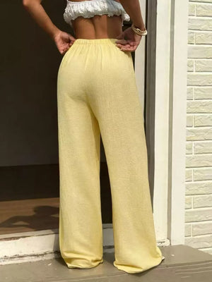 Yellow textured wide-leg pants with elastic waistband