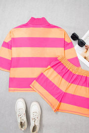 Vibrant striped two-piece set with drawstring shorts and a mock neck top in pink and orange.