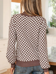 cream pullover sweater featuring buttoned and checkerboard