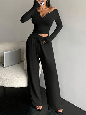 100% polyester Care instructions: Machine wash cold two-piece set in Dark Gray with fitted top, wide-leg pants silhouette