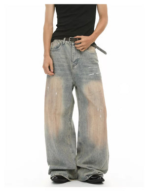 Relaxed fit vintage wash jeans in blue denim with distressed details and a baggy cut.