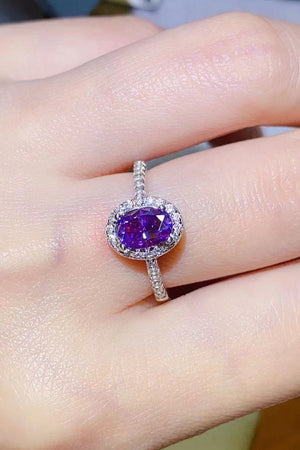 Purple moissanite oval halo ring in silver with pave band.