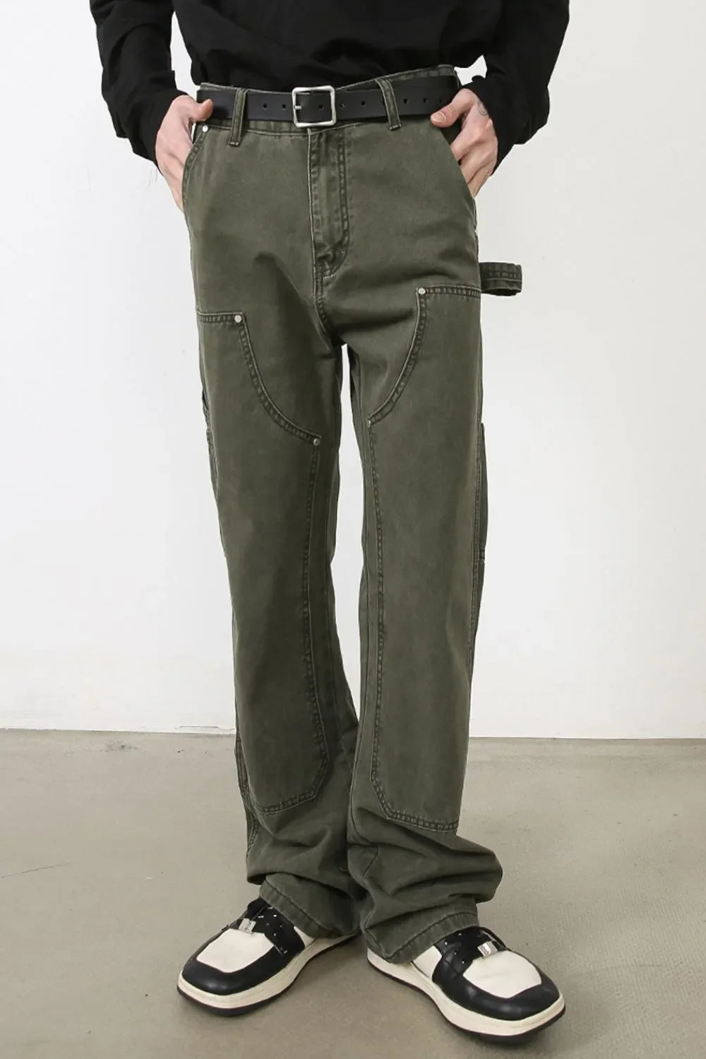Army green wide-leg jeans with utility pockets and a relaxed fit.
