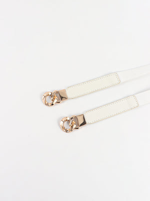 White faux leather belt with gold chain detail and gold buckle accent