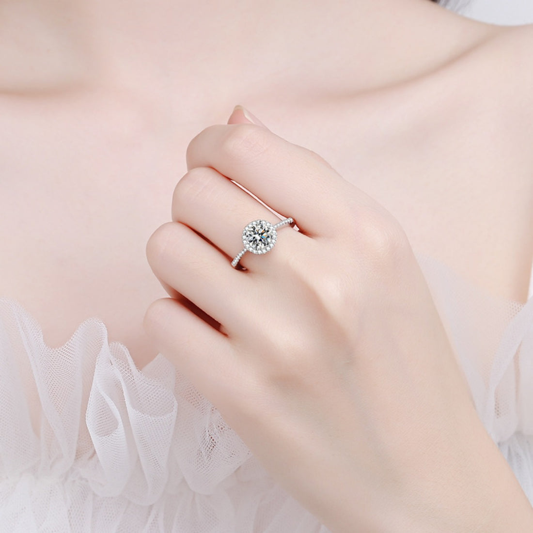 ring in silver featuring halo setting and fitted fit