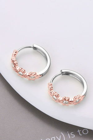 Rose gold floral embellished huggie hoop earrings with cubic zirconia on sterling silver.