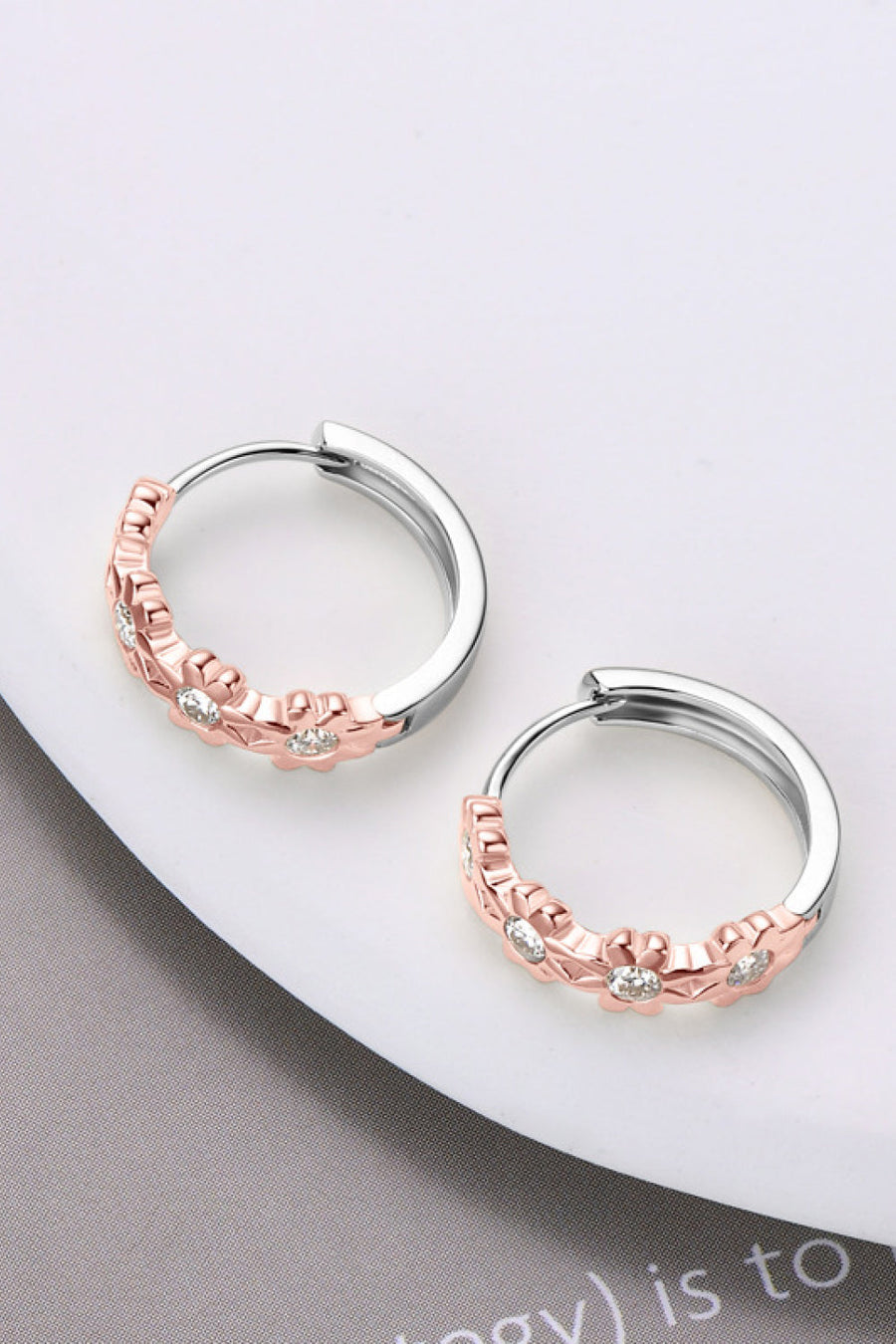 Rose gold floral embellished huggie hoop earrings with cubic zirconia on sterling silver.
