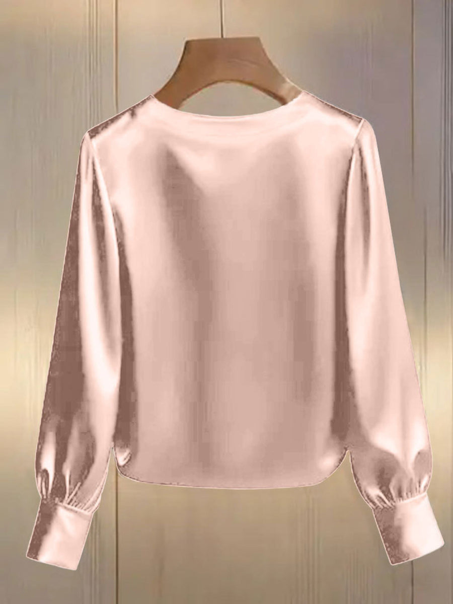 Pearl trim round neck pink satin blouse with long sleeves and button cuffs